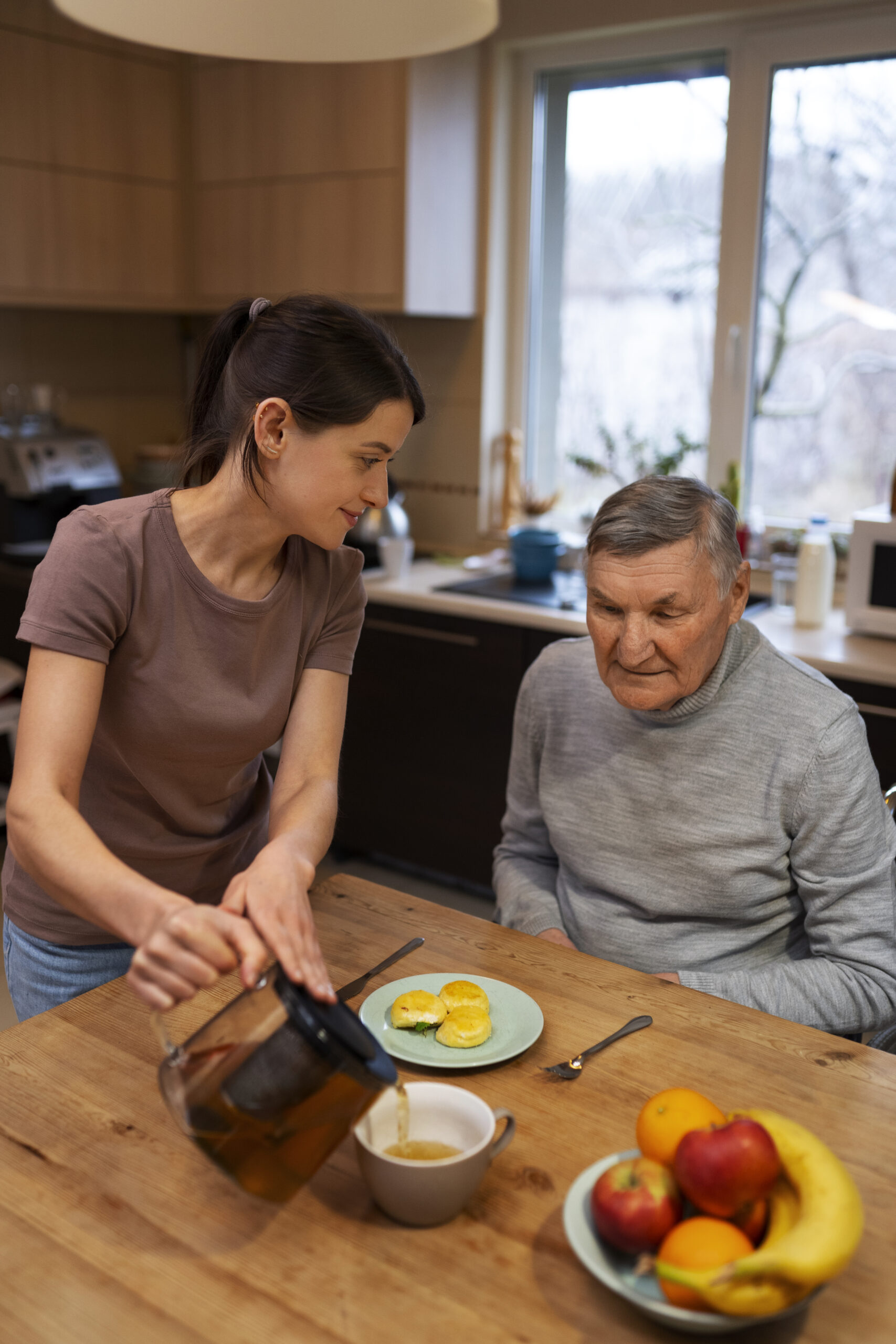 female-caretaker-with-client-home-doing-her-job
